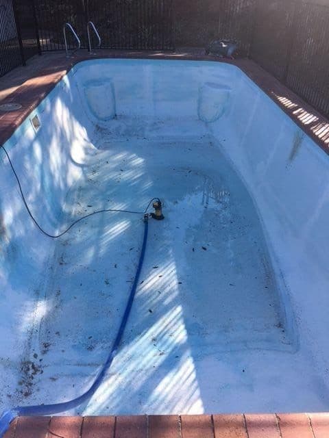 Fibreglass pool showing wear and deterioration